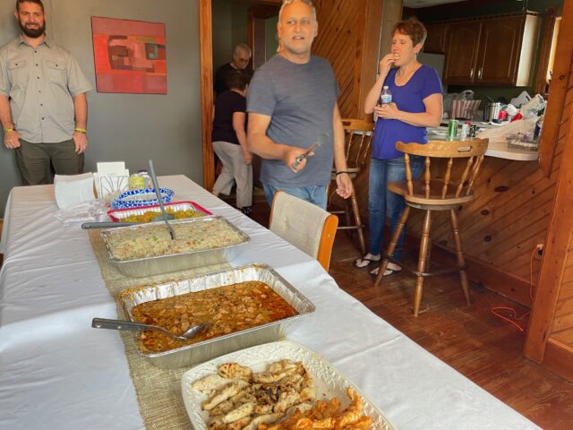 People enjoying a meal at a gathering.