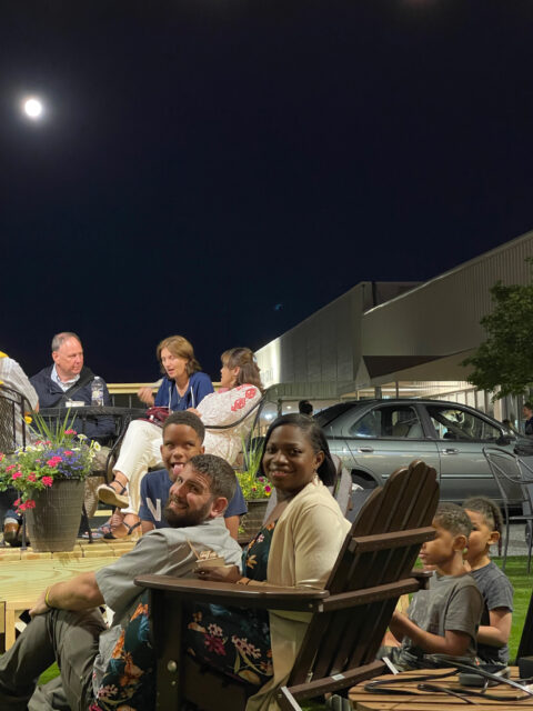 Group enjoying an outdoor evening gathering.