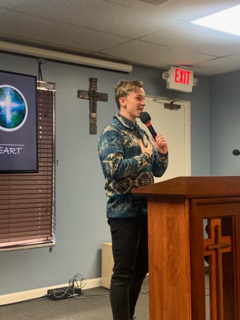Person speaking at a church podium.