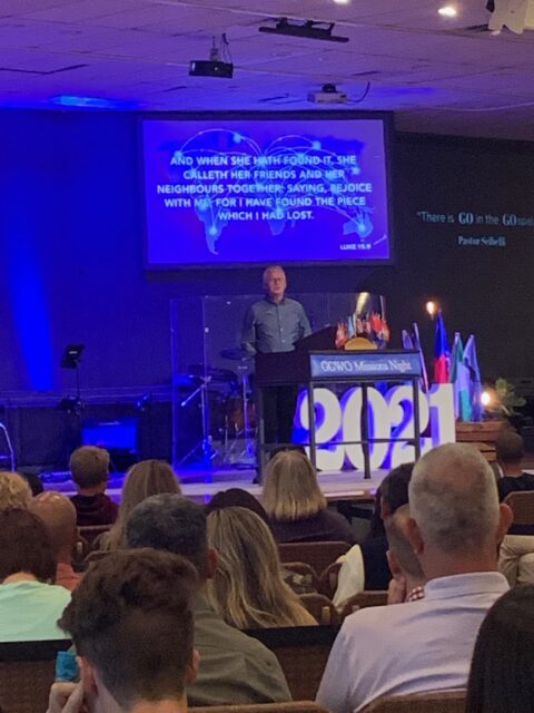 Speaker addressing audience at a church service.