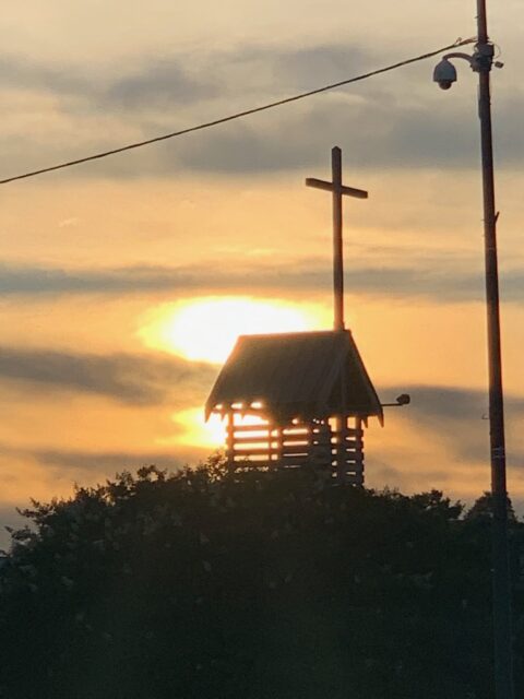 Church steeple silhouette during sunset.