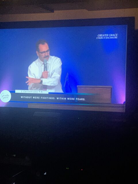 Speaker at podium during church service.