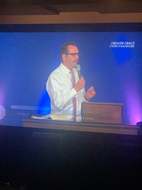 Man speaking at Greater Grace Church Baltimore.