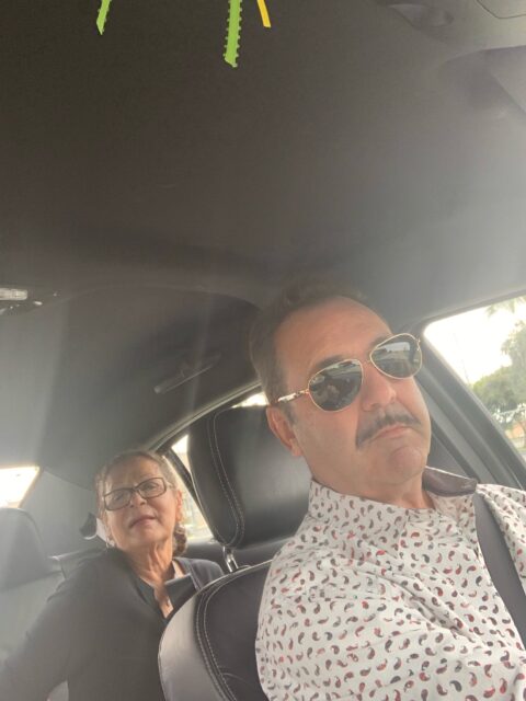 Man and woman sitting in a car.