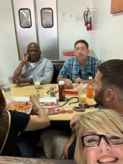 Group dining at a restaurant table.
