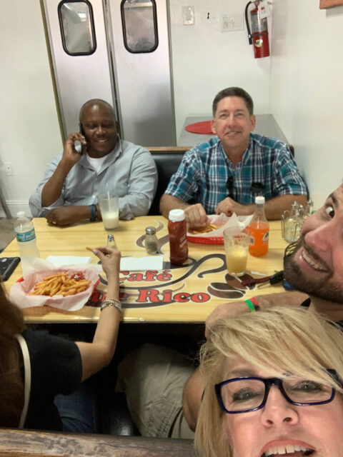 Group dining at a restaurant table.