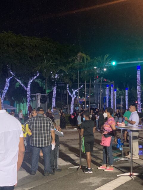 Night street scene with people and lights.