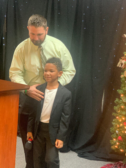 Man and boy at a festive event.