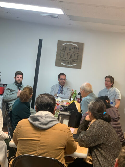 Group discussion in a meeting room setting.